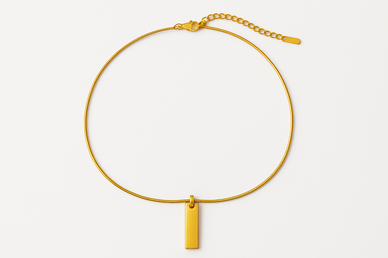 Single layer gold necklace with rectangular tag